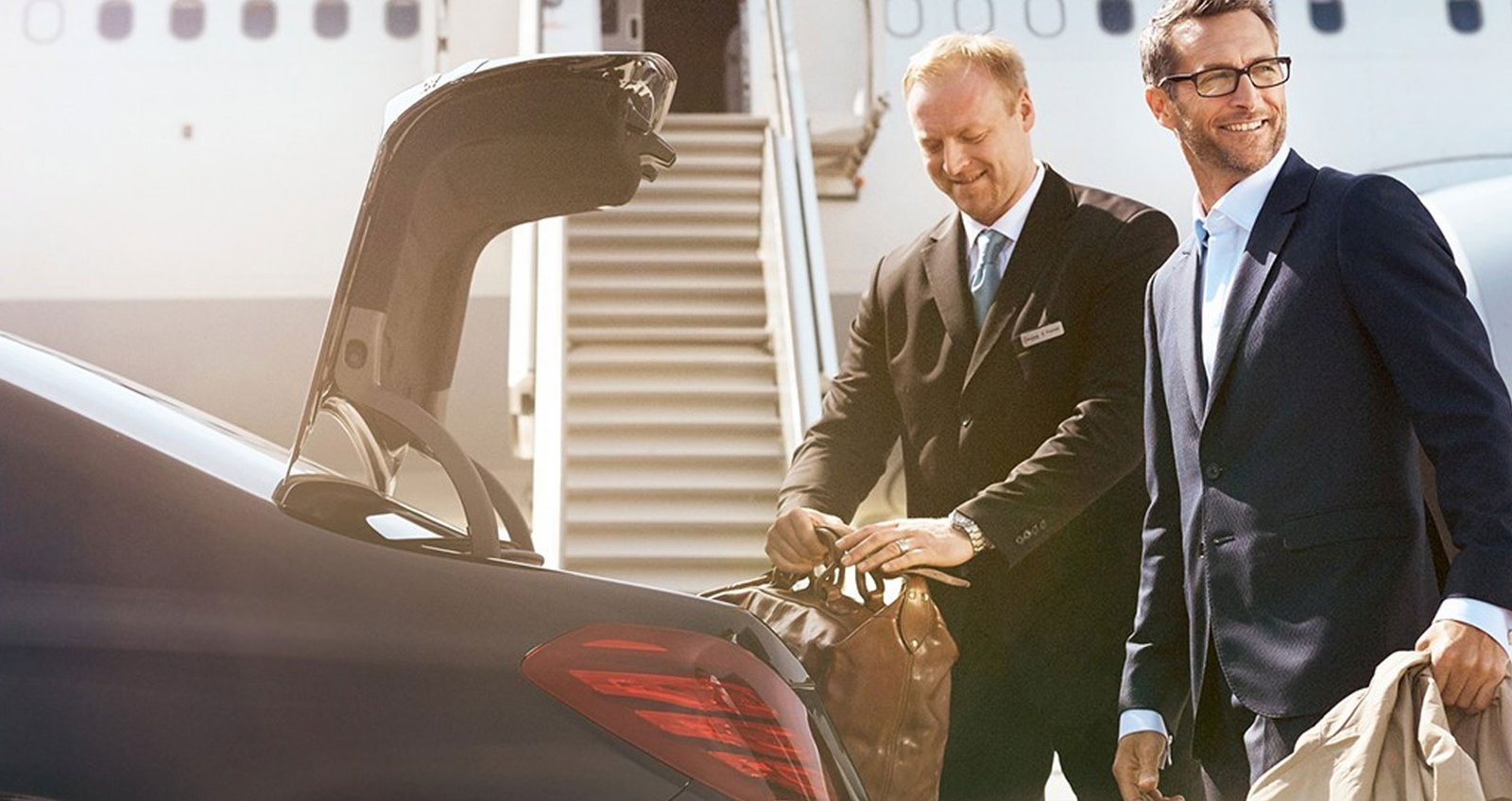Chauffeurs England driver assisting a client